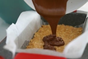 Pouring Chocolate for Gluten Free Chocolate Peanut Butter Bars