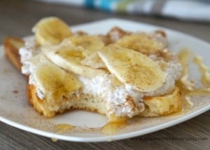 Taking a delicious bite of Healthy Ricotta, Honey and Banana on Toast Breakfast recipe