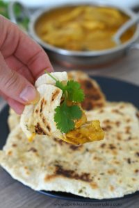 Gluten-Free Naan Bread topped with delicious curry and coriander!